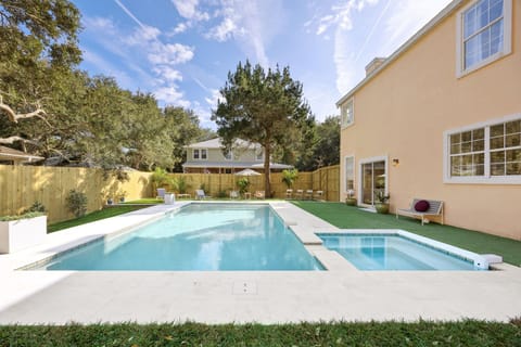 Backyard: Brand new custom pool with attached heated hot tub. The pool and hot tub are surrounded by artificial turf, which feels and looks amazing!