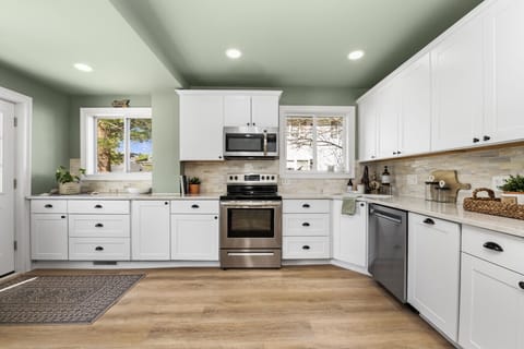 Gourmet kitchen equipped with full-size appliances, premium cookware, and plenty of counter space.