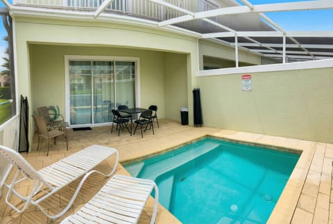 Discover your private oasis with a refreshing pool, warm wooden decking, and a cozy seating area. Large sliding doors let in natural light and offer easy outdoor access, creating the perfect setting for relaxed gatherings.