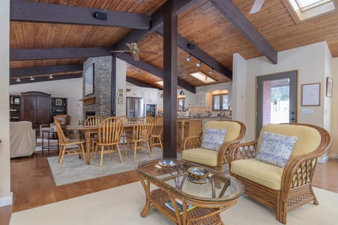 Make yourself comfortable in this stunning open-concept space where rustic charm meets modern comfort. Exposed beams and natural light create the perfect atmosphere for your getaway.