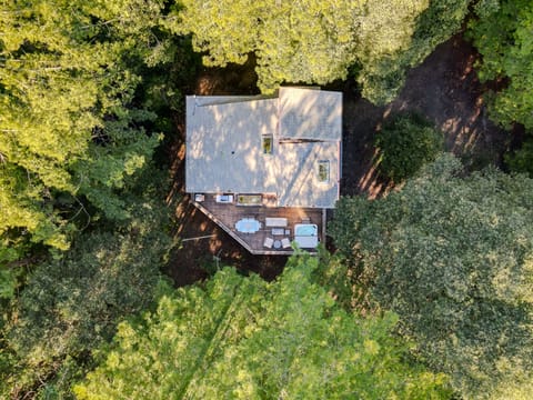 Aerial view of the property, outdoor patio & dining, hot tub, grill, and oven