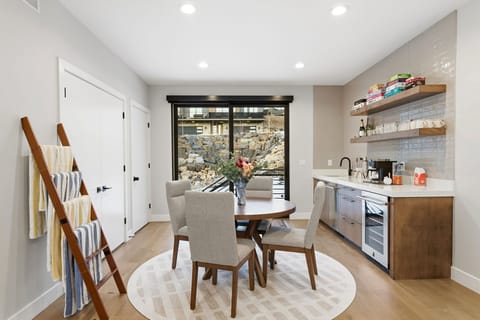 Dining area with large windows and mountain views