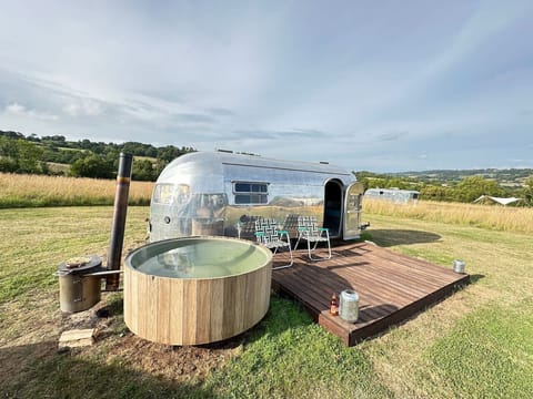 Deck, lounge chairs and hot tub make the meadow your private retreat.