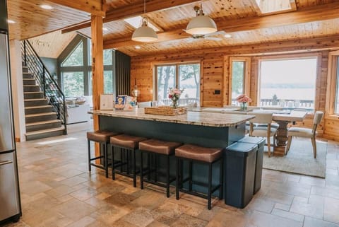 The Main Cabin
The kitchen island is the perfect spot for coloring, breakfast with a view, an extra prep space for mealtime, or a buffet station where everyone can grab their food before heading out to the screened porch or lakeside.