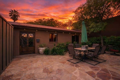 Shared front yard with multiple outdoor dining areas.