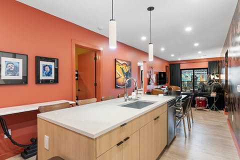 Experience the perfect blend of style and practicality in this modern kitchen, where every detail—from the countertops to the lighting—elevates your culinary experience.