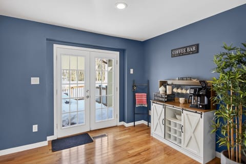 Welcome area with coffee station and access to outdoor patio.