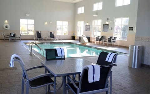 Unwind poolside with towels ready and plenty of loungers.