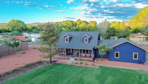 our log cabin with large lawn to play and oak creek access across the street