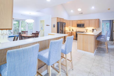 There are six stools alongside the kitchen counters.