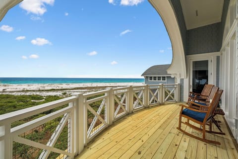 Unwind in your rocker and let the soothing rhythm of the waves melt away your worries as you soak in stunning turquoise waters and soft white sand just steps from your covered deck.