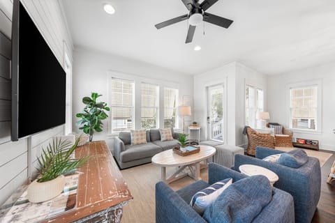 Unwind in your bright, airy living space with cozy seating and coastal charm that invites relaxation.