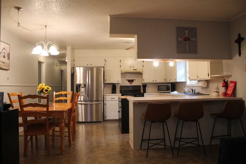 Kitchen/Dining: Table seats 6; bar seats 3.