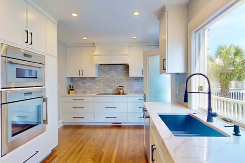 A large window offers pretty views while in the kitchen