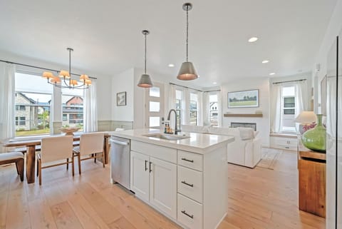 The kitchen at Hygge Ridge is well stocked with all of the amenities and tools a chef needs to cook meals for a group.  The dining table seats 6 and there are 2 additional bar seats at the island
