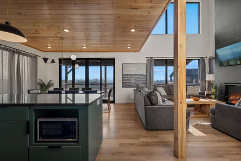Sleek Open Floor Plan on Main level with Mountain Views and tons of Natural lighting. 
