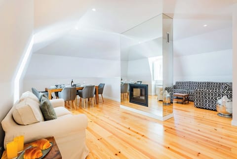 Living Room and Dining Room with a double-sided fireplace.