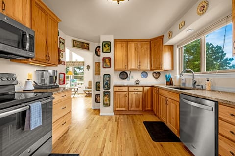 Kitchen sink window overlooks the backyard