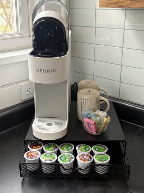 Keurig coffee station with a selection of coffee, tea, and mugs to start your da