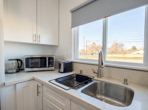 Bright kitchen corner with microwave and coffee station