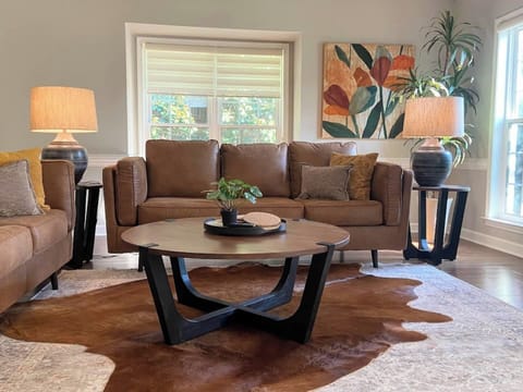 Twin couches in rich suede,  add a touch of earthy sophistication to your stay.