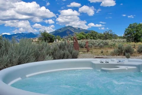 The hot tub has a great view of the Taos mountains.