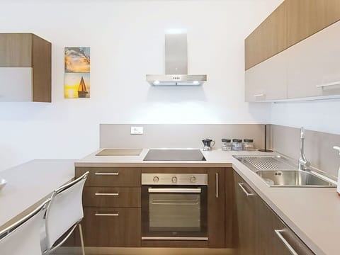 Kitchen, Kitchen Appliance, Countertop, Cabinetry, Major Appliance, Interior Design, Furniture, Flooring, Wood, Kitchen Stove