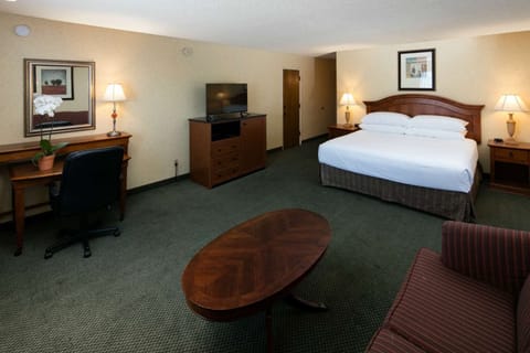 Spread out with a dedicated workspace and comfortable seating area.