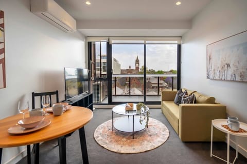 Sun-drenched Living Area with Sweeping City Views