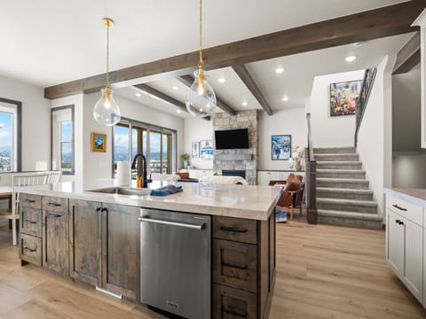 The chefs kitchen is well appointed with high end professional appliances, beautiful custom granite counter tops a built in dining table and bar seating for 5 and a large butlers pantry with wine fridge, extra preparation surface and numerous countertop appliances