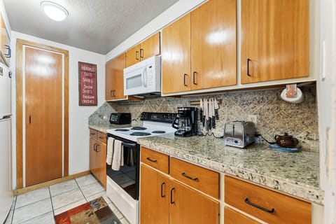 Your fully equipped kitchen features granite counters, modern appliances, and everything needed to create memorable meals during your stay.