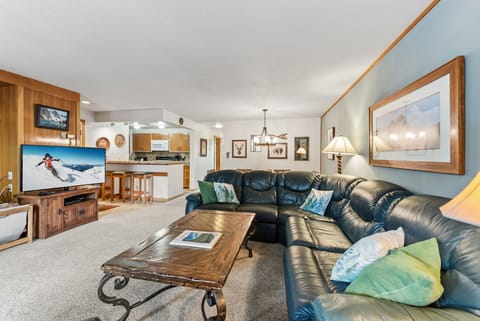 Sink into plush leather seating while mountain views play on your big screen TV in this cozy living space.