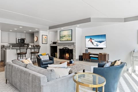 Sink into plush seating by your crackling fireplace, where mountain adventures await on the big screen and memories are made.