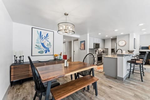 Gather around your beautiful dining table and enjoy meals in this bright, open space that flows seamlessly into your fully-equipped kitchen.