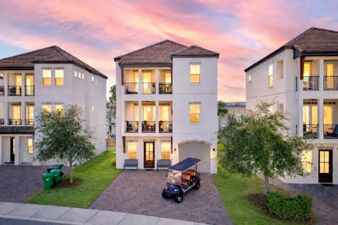 Sandy Saddle | Luxury 6BR Retreat Sleeps 18 — Stunning exterior in The Retreat at Miramar featuring a game room, FREE street-legal 6-passenger golf cart, 2-minute ride to the beach, and access to a 90-ft HEATED community pool & clubhouse.