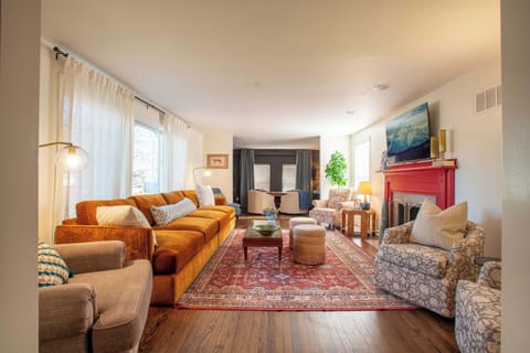 This is a classic comfy family room, with a game table in the back.