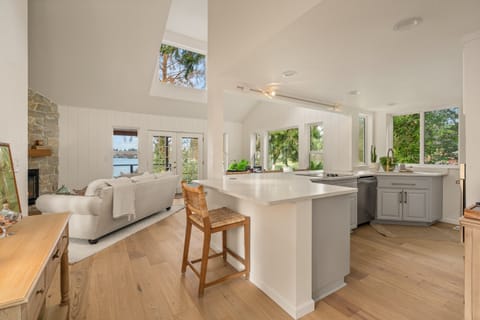 Great room lives so much more open and the views of the lake fill the room.