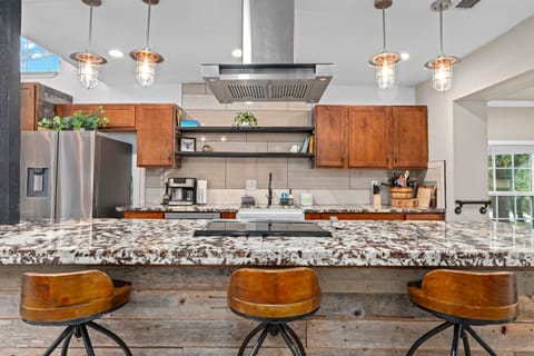 Island seating for the spectators, critics, and anyone who promises to help but mostly just snacks.