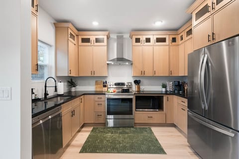 Kitchen: Featuring premium stainless steel finishes, ample storage, and generous counter space.