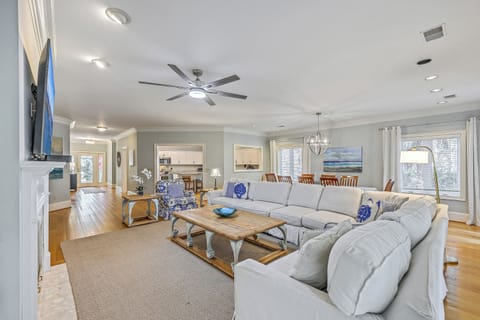 Unwind in this warm, inviting family atmosphere featuring plush seating and light-filled views.