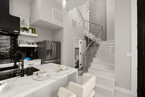 Open-concept kitchen with premium appliances.