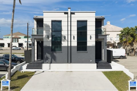 Welcome to 102A E. Whiting (left side only) a modern coastal retreat located in the heart of South Padre Island.