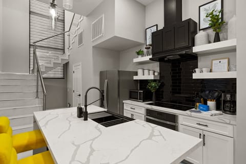 Open-concept kitchen with premium appliances.