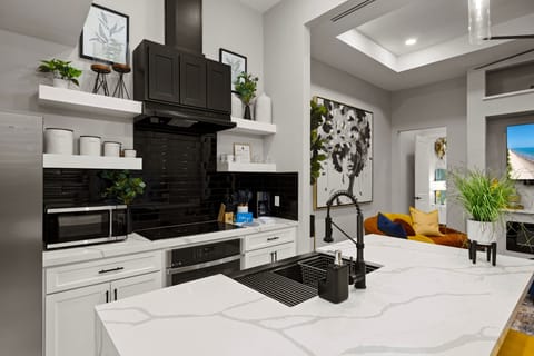 Fully equipped modern kitchen with spacious countertops and high-end finishes for easy meal prep.