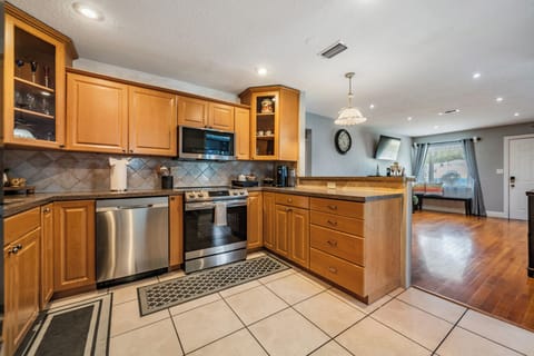 Cook with ease in our spacious kitchen, featuring ample cabinets and countertops for storage, prep, and everything you need for a seamless culinary experience.