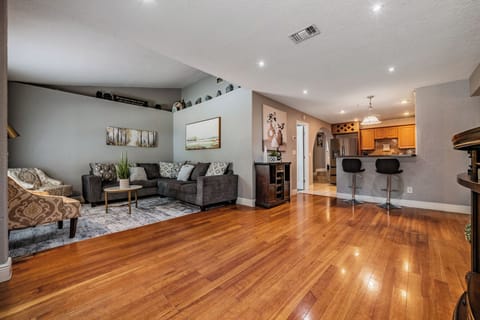 Chat and entertain effortlessly in the open-concept living room that flows seamlessly into the kitchen.