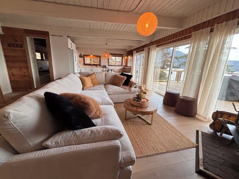 Refreshed living room to kitchen view in the Salt Cabin. Turn towards the windows and all you see is deck and ocean! 