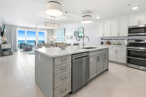 Your spacious kitchen flows seamlessly into the living area, where you'll wake up to stunning ocean views every morning.