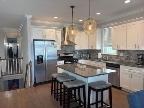 Kitchen with modern appliances and island seating for 4.