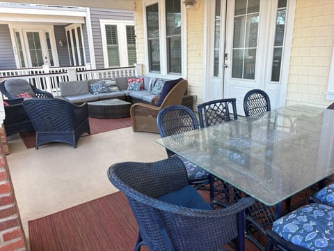 Massive porch with dining area & separate seating area. Watch the world go by!